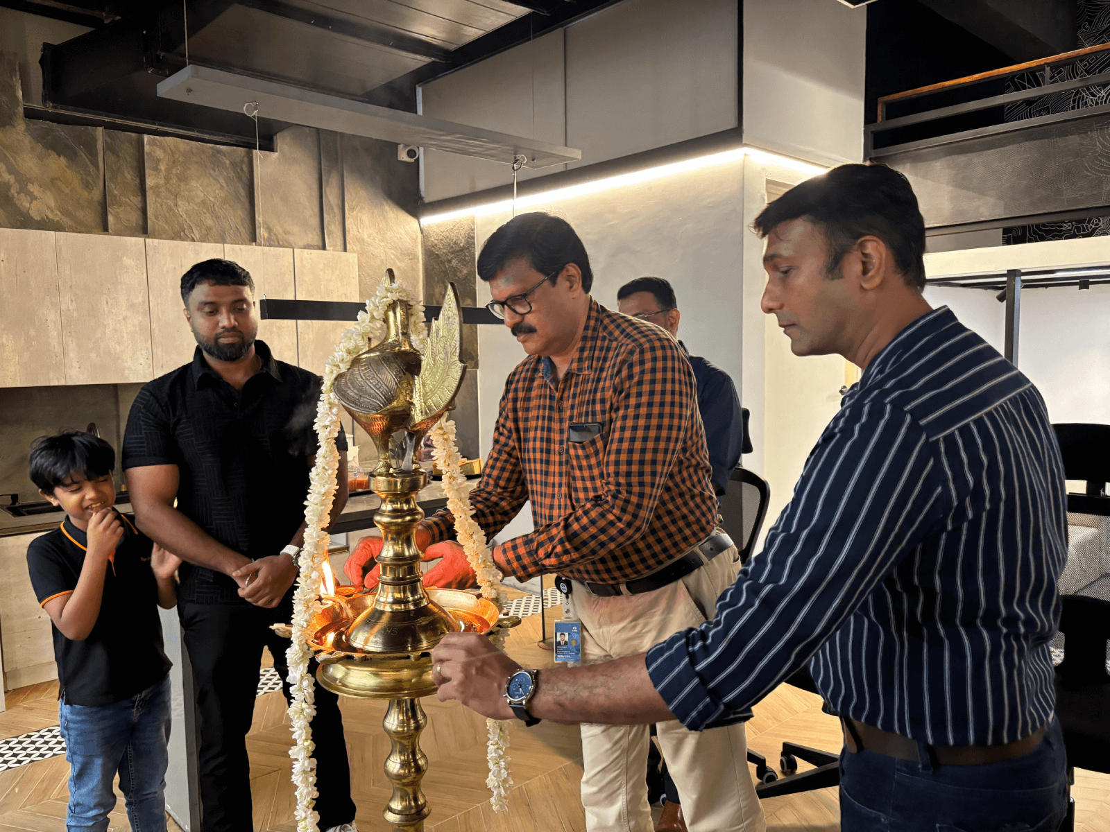 The lighting of the auspicious lamp on the occasion of the opening of Marvelloux's second office at Technopark Phase I - Gayathri building.