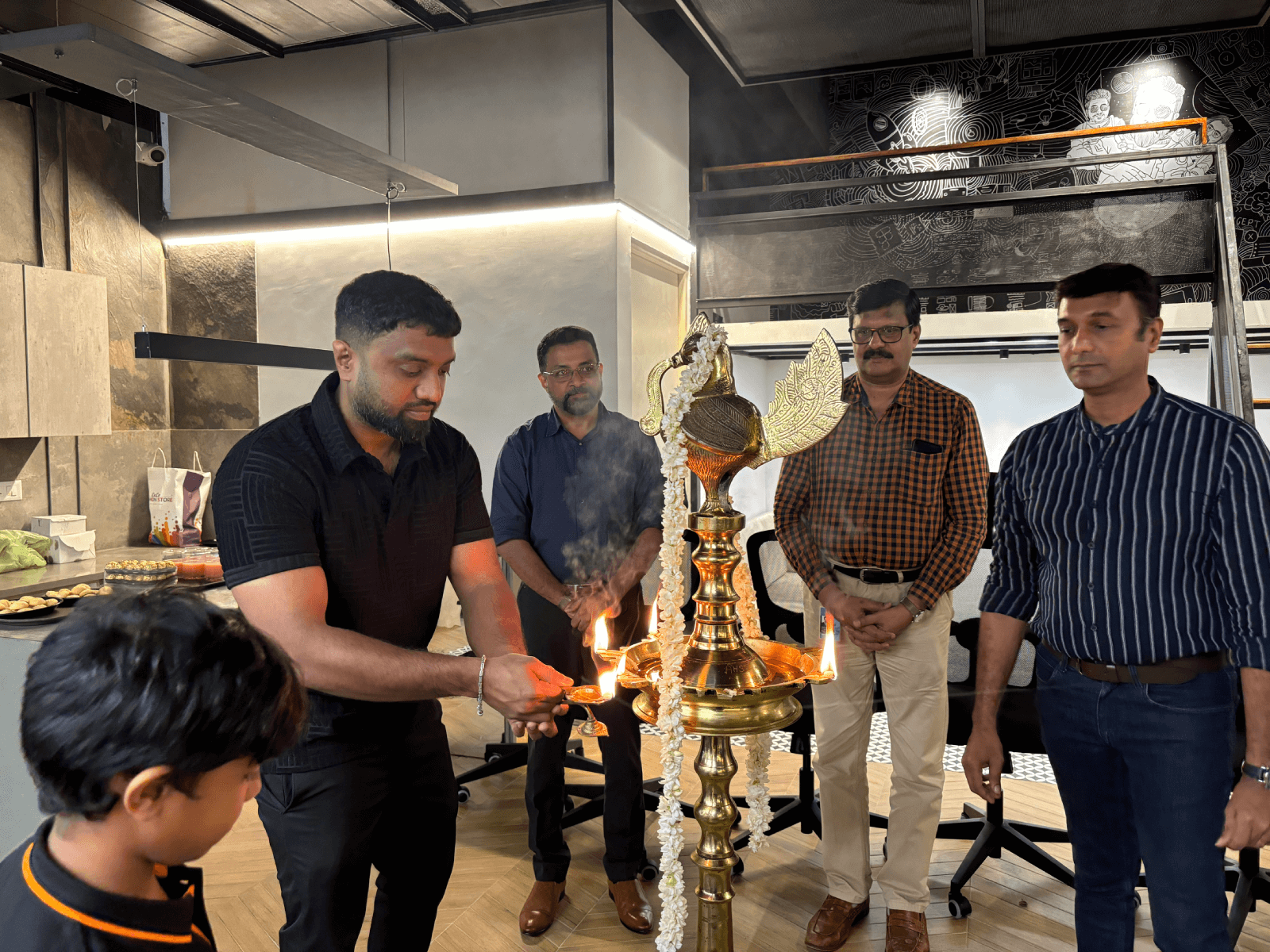 The lighting of the auspicious lamp on the occasion of the opening of Marvelloux's second office at Technopark Phase I - Gayathri building.