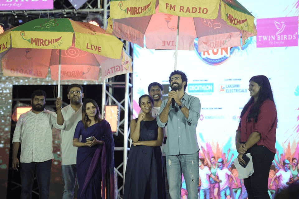 Chief guests, actors Roshan Mathew and Darshana Rajendran, along with Team 'Paradise,' addressing the crowd.