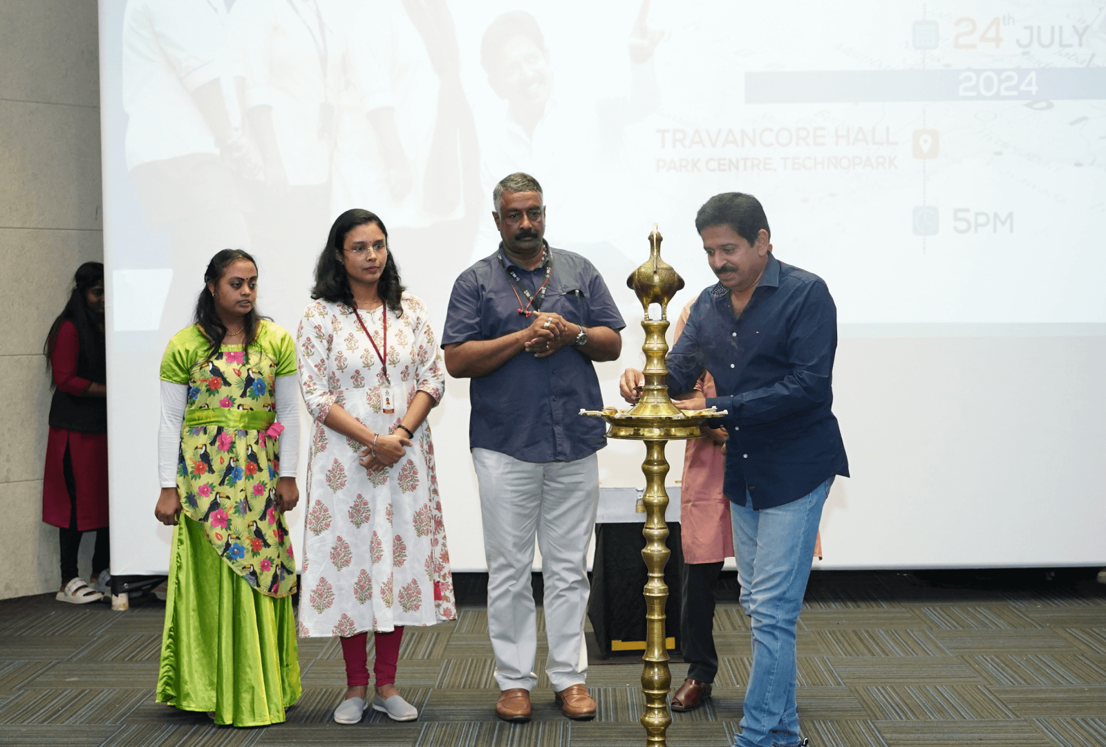 Shri Gopinath Muthukad, renowned magician and founder of DAC, inaugurating the Unified Voices event by lighting the auspicious lamp.