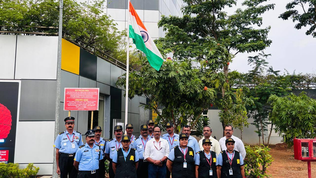 Shri Suresh Kumar K, Secretary-Registrar of Kerala IT Parks with security staff, after flag hoisting at the Technopark Phase III campus on Independence Day.