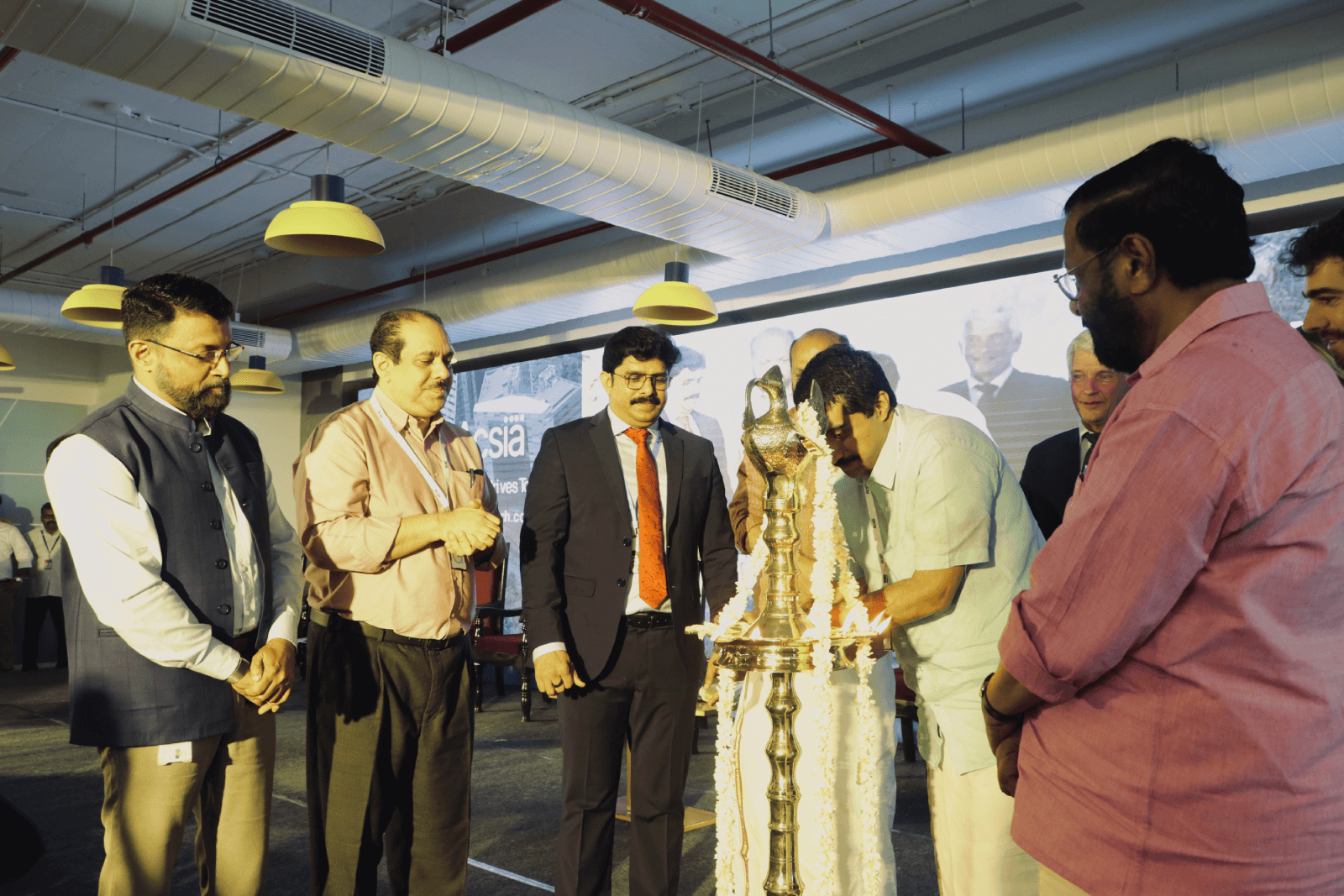 Shri. Ajay Prasad, Managing Director & CEO of Taurus Investment Holdings, lighting the inaugural lamp at the launch.