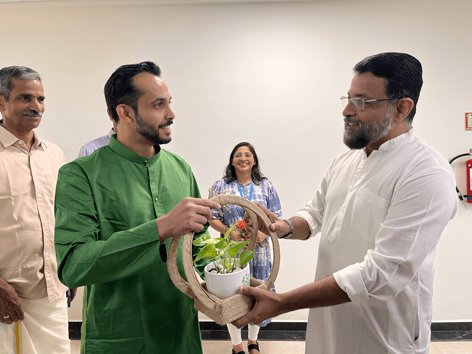 Col Nair accepting a token of appreciation from Mr. Naduvath.