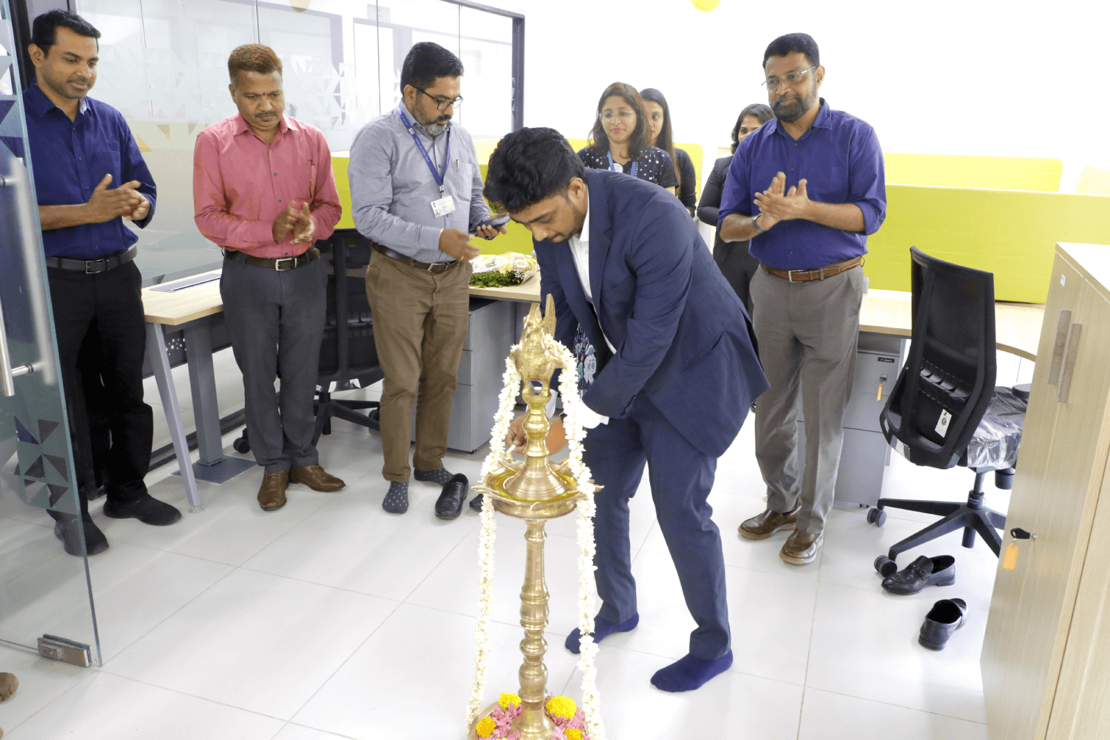 Mr. Sajan S Nandan, CEO and Founder at NxtGenix Solutions, lighting the lamp.