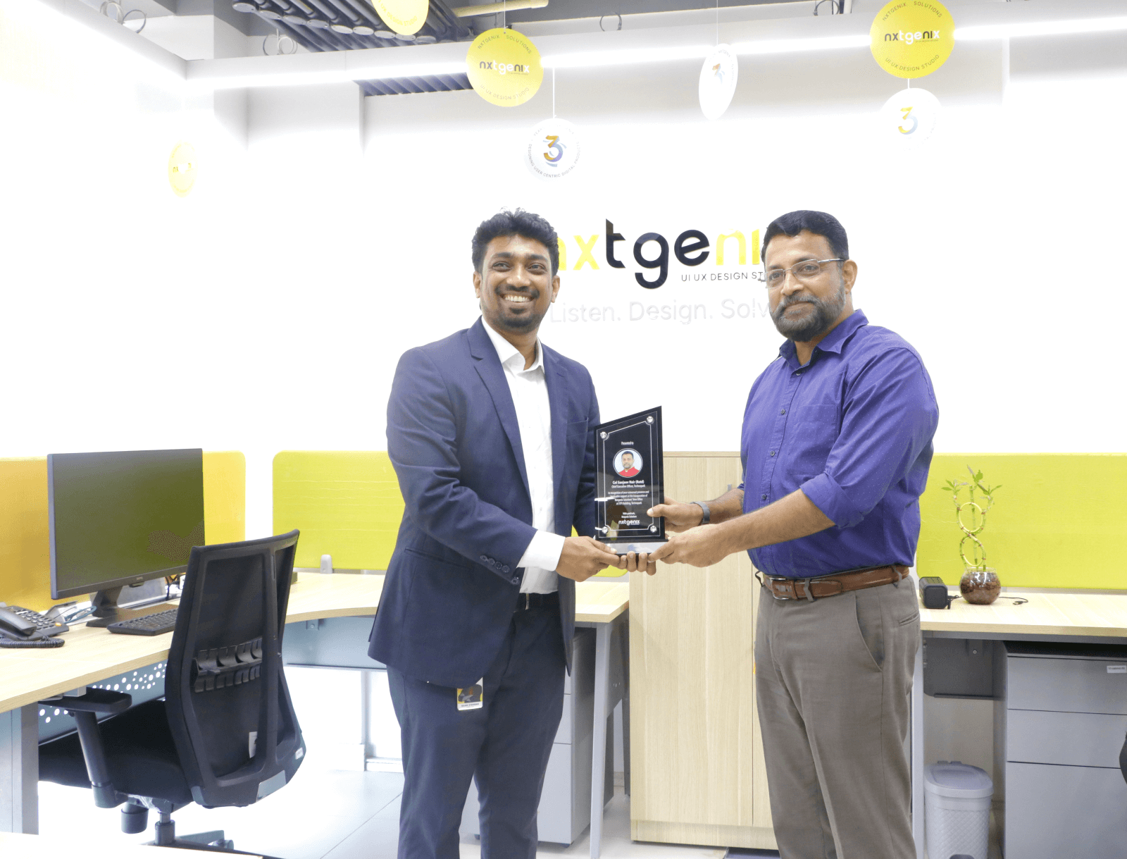 Col Sanjeev Nair (Retd), CEO, Technopark, receiving a memento from Mr. Sajan S Nandan, CEO and Founder at NxtGenix Solutions.