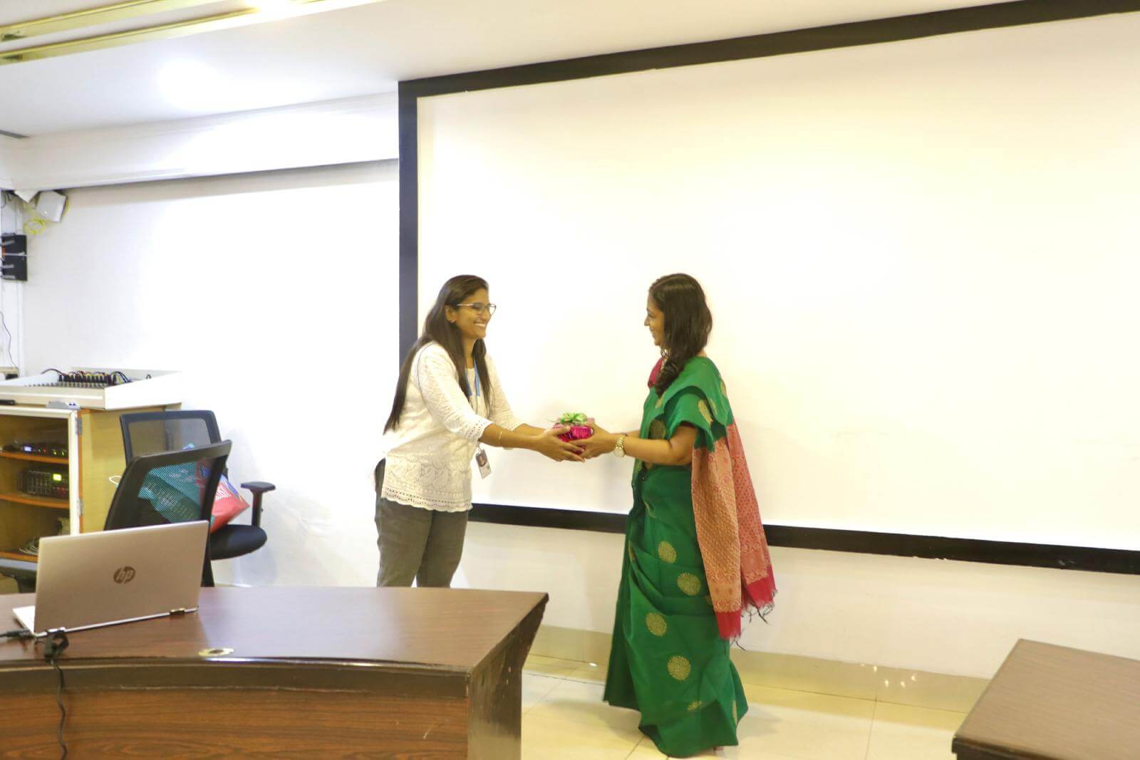 Ms Aditi Radhakrishnan, Member, WIIT, Life Coach, being presented a token of appreciation.