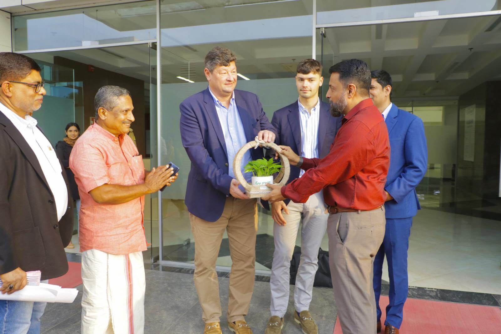 Col Sanjeev Nair (Retd), CEO Technopark, presenting a token of appreciation to Mr. Stephane Fund, CEO Trasna Technologies.