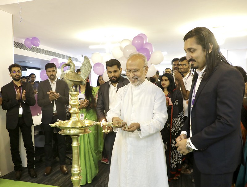 Dr. Abraham Mulamoottil lighting the ceremonial lamp at the launch.