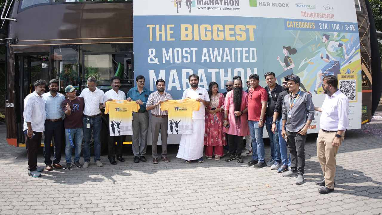 Shri Chandy Oommen, Col Sanjeev Nair (Retd), Mr. Sreekumar V, and Mr. Manoj Elanjickal at the official t-shirt launch.